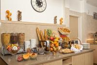 a counter with many different types of fruits and vegetables at Residhome Paris-Evry in Courcouronnes