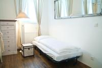 A bed or beds in a room at Vintagehome Schönbrunn