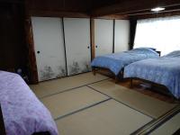 Cottage Yakusugi Houseにあるベッド