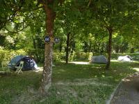 a group of tents in the shade of trees at Family&#39;s Camping Le Savoy in Challes-les-Eaux