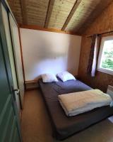 a bedroom with two beds in a room with a window at Family&#39;s Camping Le Savoy in Challes-les-Eaux