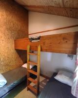 a bunk bed with a ladder in a room at Family&#39;s Camping Le Savoy in Challes-les-Eaux