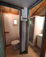 a bathroom with a toilet and a sink at Family&#39;s Camping Le Savoy in Challes-les-Eaux