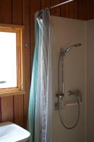 a shower in a bathroom with a shower curtain at Family&#39;s Camping Le Savoy in Challes-les-Eaux