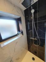 a bathroom with a shower and a window at Maison avec jardin &quot;les Néréïdes&quot; port et plage de la Pointe Rouge Marseille in Marseille