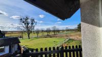 a view of a field from a balcony at Pension am Silberberg in Gartz an der Oder