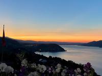 a view of a body of water at sunset at Eva&#39;s Seeblick in Krattigen