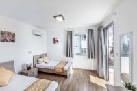Postel nebo postele na pokoji v ubytování Villa Ana Coral