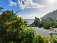 a view of the ocean from a resort at Bungalow Java - Bassin Manapany-Les-Bains in Saint-Joseph