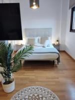Łóżko lub łóżka w pokoju w obiekcie My Suites Madrid - Aeropuerto Ifema