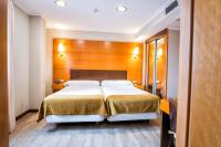 A bed or beds in a room at Hotel Alda Bonaval