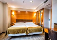 A bed or beds in a room at Hotel Alda Bonaval