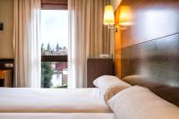 A bed or beds in a room at Hotel Alda Bonaval