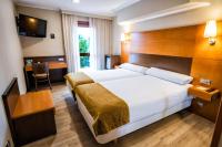 A bed or beds in a room at Hotel Alda Bonaval