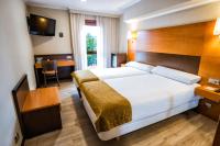 A bed or beds in a room at Hotel Alda Bonaval