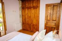 Postel nebo postele na pokoji v ubytování La Bolera Paraíso Astur