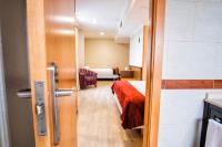 A bed or beds in a room at Hotel Alda Bonaval