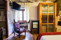 A bed or beds in a room at Hotel Alda Bonaval