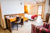 A bed or beds in a room at Hotel Alda Bonaval