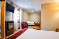 A bed or beds in a room at Hotel Alda Bonaval