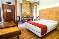 A bed or beds in a room at Hotel Alda Bonaval