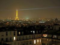 a view of the eiffel tower at night at Luxury flat with amazing view on Eiffel Tower in Paris