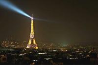 a view of the eiffel tower at night at Luxury flat with amazing view on Eiffel Tower in Paris