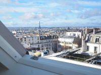 a view of a city from a balcony at Luxury flat with amazing view on Eiffel Tower in Paris