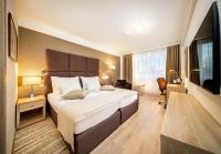 Postel nebo postele na pokoji v ubytování Apollo Hotel Bratislava