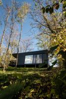 a glass house on a hill in the woods at Stüble Kabinok in Somogyhárságy