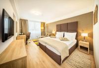 Postel nebo postele na pokoji v ubytování Apollo Hotel Bratislava