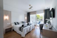 A bed or beds in a room at Sagitario Playa