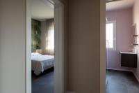 a bedroom with a bed and a mirror at Suite Dall'Alba al Tramonto in Mogliano Veneto