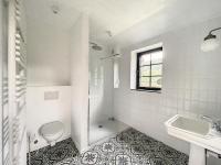 a white bathroom with a toilet and a sink at Gîte à Esneux - A La Belle Epoque d&#39;Esneux in Esneux