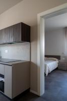 a room with a kitchen with a bed in it at Suite Dall'Alba al Tramonto in Mogliano Veneto