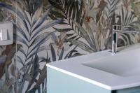 a bathroom with a sink and a floral wallpaper at Suite Dall'Alba al Tramonto in Mogliano Veneto