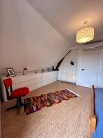 A bed or beds in a room at La jolie Maison de Marie - Clim &amp; Terrasse - Meyssac