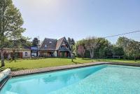 a large swimming pool in front of a house at Gîte de France Bayat 4 épis - Gîte de France 5 personnes 354 in Varetz