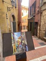a painting on display on a city street at Coquet Studio Cœur de Grasse in Grasse