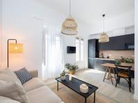 A television and/or entertainment centre at Bright and Elegant Gran Via apartments