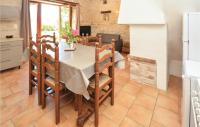 a kitchen and dining room with a table and chairs at Amazing Home In Barjac With 3 Bedrooms, Wifi And Outdoor Swimming Pool in Barjac