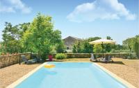a swimming pool with a frisbee in a yard at Amazing Home In Barjac With 3 Bedrooms, Wifi And Outdoor Swimming Pool in Barjac