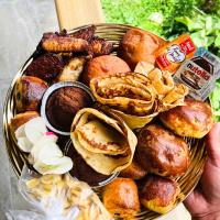 a basket filled with different types of pastries at Villa Red Palmer -sauna jacuzzi in Gros-Morne