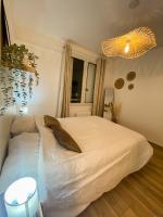 Cama ou camas em um quarto em Appartement cosy au coeur de Reims
