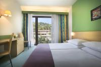 Ein Bett oder Betten in einem Zimmer der Unterkunft Remisens Hotel LUCIJA