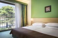 Ein Bett oder Betten in einem Zimmer der Unterkunft Remisens Hotel LUCIJA