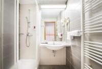 Ein Badezimmer in der Unterkunft Remisens Hotel LUCIJA