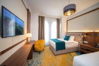 Cama o camas de una habitaci&oacute;n en Grand Hotel Belushi