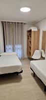 A bed or beds in a room at Apartamentos Gran Socaire de Noja