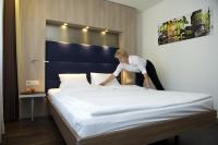 Hotel Alexander Zurich Old Townにあるベッド